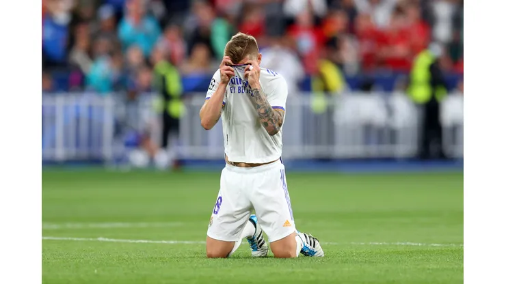 PARIS, FRANCE - MAY 28: Toni Kroos of Real Madrid drops to his knees as he celebrates winning the UEFA Champions League final match between Liverpool FC and Real Madrid at Stade de France on May 28, 2022 in Paris, France. (Photo by Catherine Ivill/Getty Images)