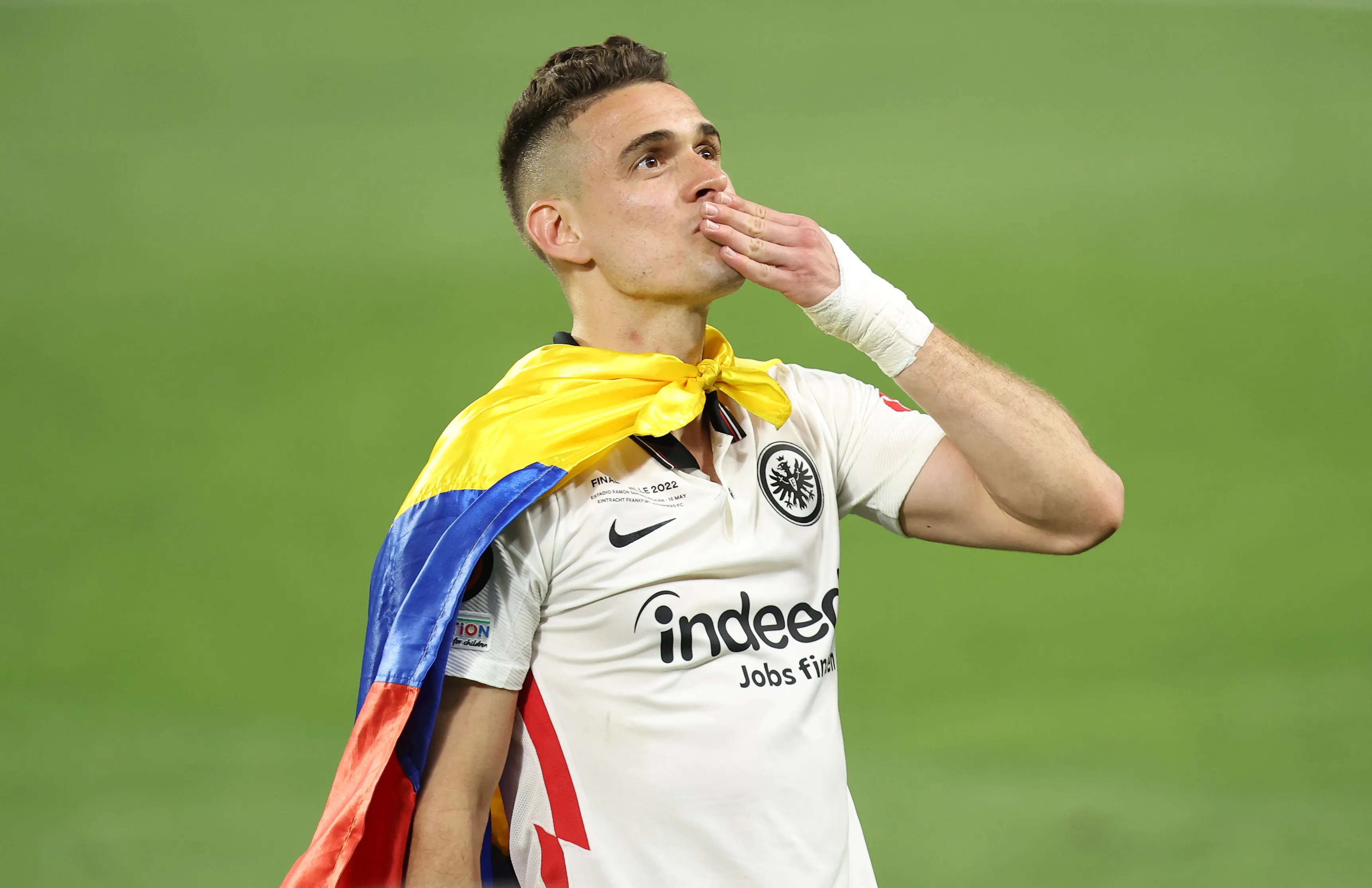 SEVILLE, SPAIN – MAY 18: Rafael Santos Borre of Eintracht Frankfurt celebrates with the fans after winning the UEFA Europa League during the UEFA Europa League final match between Eintracht Frankfurt and Rangers FC at Estadio Ramon Sanchez Pizjuan on May 18, 2022 in Seville, Spain. (Photo by Alex Grimm/Getty Images)