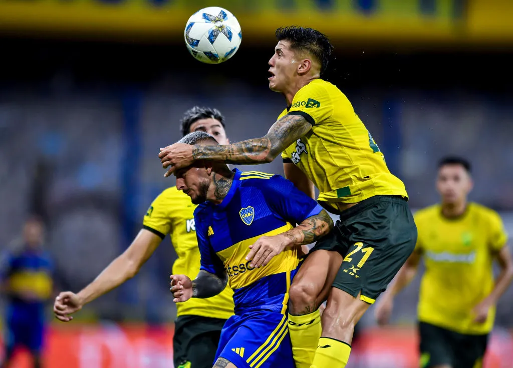 BUENOS AIRES, ARGENTINA – FEBRUARY 10: Santiago Ramos Mingo of Defensa y Justicia heads the ball against Dario Benedetto of Boca Juniors during a Copa de la Liga 2024 group B match between Boca Juniors and Defense y Justicia at Estadio Alberto J. Armando on February 10, 2024 in Buenos Aires, Argentina. (Photo by Marcelo Endelli/Getty Images)