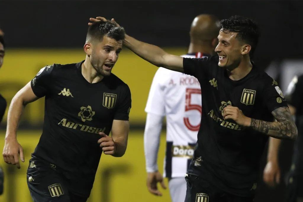 LIMA, PERU – SEPTEMBER 23: Benjamín Garré (L) of Racing Club celebrates with teammates after scoring the second goal of his team during a Group F match between Alianza Lima and Racing Club as part of Copa CONMEBOL Libertadores 2020 at Estadio Alejandro Villanueva on September 23, 2020 in Lima, Peru. (Photo by Paolo Aguilar – Pool/Getty Images)