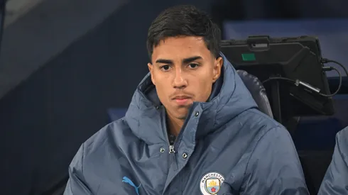 MANCHESTER, ENGLAND – JANUARY 25: Vitor Reis of Manchester City looks on from the substitutes bench prior to the Premier League match between Manchester City FC and Chelsea FC at Etihad Stadium on January 25, 2025 in Manchester, England. (Photo by Michael Regan/Getty Images)