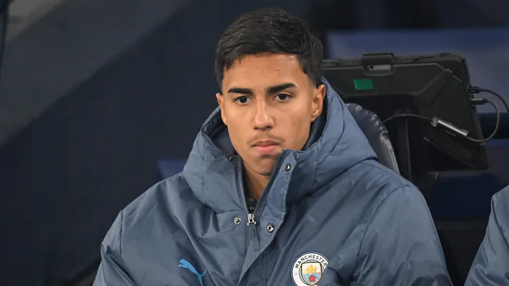 MANCHESTER, ENGLAND - JANUARY 25: Vitor Reis of Manchester City looks on from the substitutes bench prior to the Premier League match between Manchester City FC and Chelsea FC at Etihad Stadium on January 25, 2025 in Manchester, England. (Photo by Michael Regan/Getty Images)