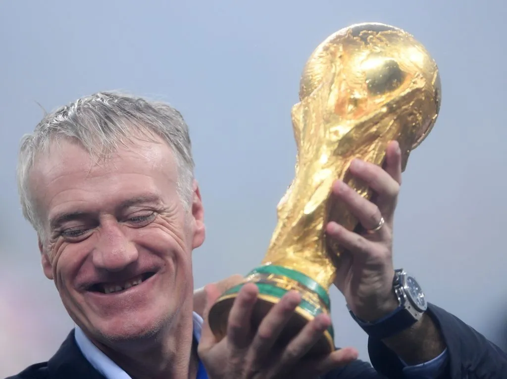 MOSCOW, RUSSIA – JULY 15:  Didier  Deschamps of France holds the World Cup trophy aloft during the victory celebrations after the 2018 FIFA World Cup Russia Final between France and Croatia at Luzhniki Stadium on July 15, 2018 in Moscow, Russia.  (Photo by Laurence Griffiths/Getty Images)