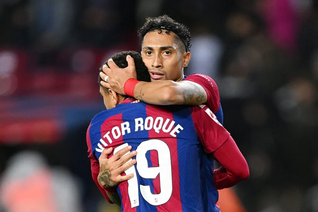 BARCELONA, SPAIN – MARCH 30: Vitor Roque and Raphinha of FC Barcelona embrace after the team’s victory in the LaLiga EA Sports match between FC Barcelona and UD Las Palmas at Estadi Olimpic Lluis Companys on March 30, 2024 in Barcelona, Spain. (Photo by David Ramos/Getty Images)