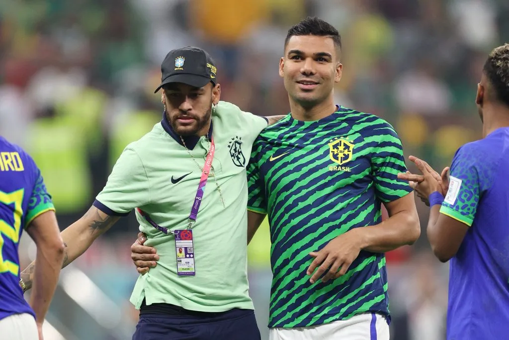 LUSAIL CITY, QATAR – DECEMBER 02: Neymar and Casemiro of Brazil reacts after the team’s qualification to the knockout stages during the FIFA World Cup Qatar 2022 Group G match between Cameroon and Brazil at Lusail Stadium on December 02, 2022 in Lusail City, Qatar. (Photo by Richard Heathcote/Getty Images)
