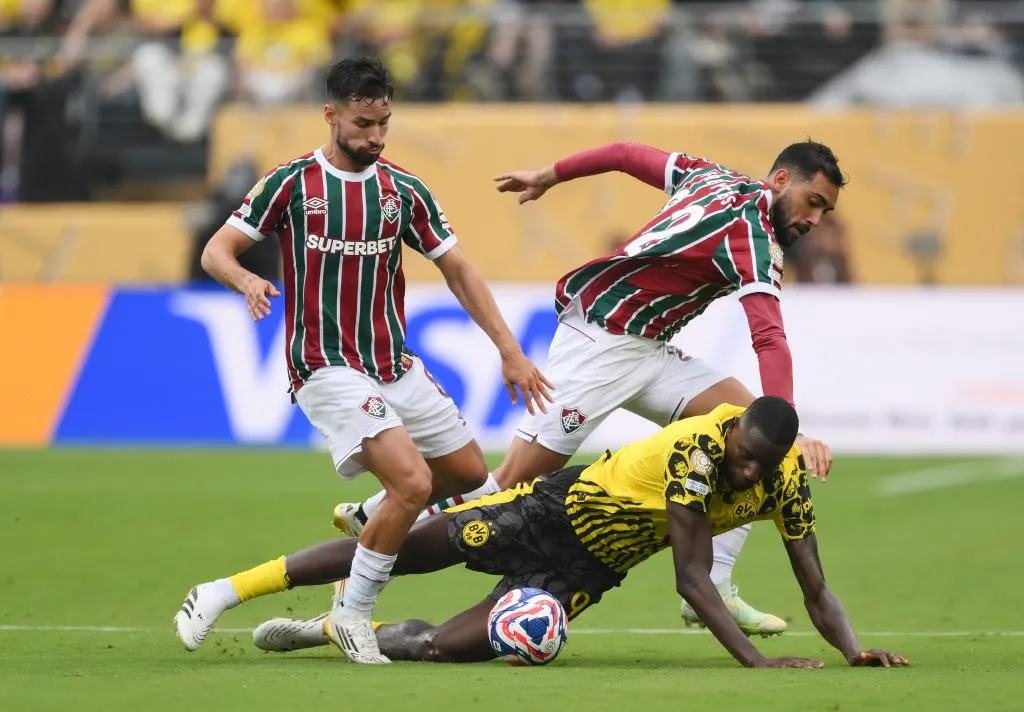 EAST RUTHERFORD, NEW JERSEY – JUNE 17: Matheus Martinelli #8 and Juan Freytes #22 of Fluminense FC collide with Serhou Guirassy #9 of Borussia Dortmund during the FIFA Club World Cup 2025 group F match between Fluminense FC and Borussia Dortmund at MetLife Stadium on June 17, 2025 in East Rutherford, New Jersey. (Photo by David Ramos/Getty Images)