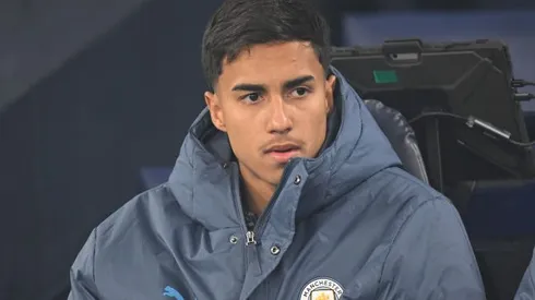 MANCHESTER, ENGLAND – JANUARY 25: Vitor Reis of Manchester City (L) looks on from the substitutes bench prior to the Premier League match between Manchester City FC and Chelsea FC at Etihad Stadium on January 25, 2025 in Manchester, England. (Photo by Michael Regan/Getty Images)