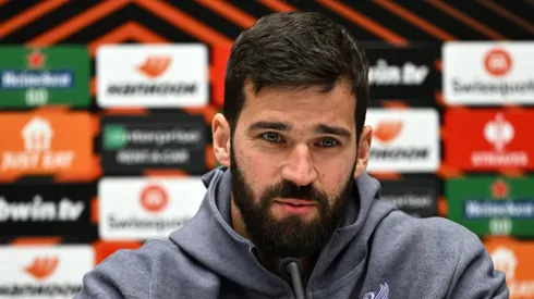 Alisson Becker of Liverpool FC talks to the media during the UEFA Europa League 2023/24 quarter-final second leg press conference at Gewiss Stadium on April 17, 2024 in Bergamo, Italy.