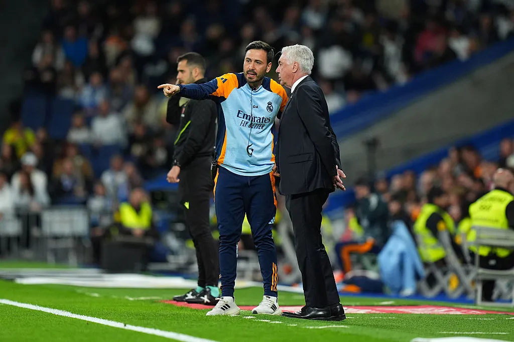 MADRID, SPAIN – MAY 14: Davide Ancelotti, Assistant Manager of Real Madrid, speaks with Carlo Ancelotti, Head Coach of Real Madrid, during the LaLiga match between Real Madrid CF and RCD Mallorca at Estadio Santiago Bernabeu on May 14, 2025 in Madrid, Spain. (Photo by Angel Martinez/Getty Images)