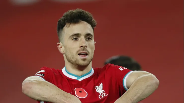 LIVERPOOL, ENGLAND - OCTOBER 31: Diogo Jota of Liverpool celebrates after scoring his team's second goal which is later ruled offside by VAR during the Premier League match between Liverpool and West Ham United at Anfield on October 31, 2020 in Liverpool, England. Sporting stadiums around the UK remain under strict restrictions due to the Coronavirus Pandemic as Government social distancing laws prohibit fans inside venues resulting in games being played behind closed doors. (Photo by Clive Brunskill/Getty Images)