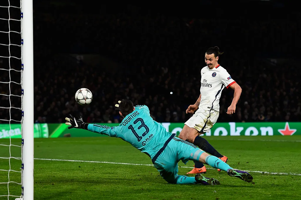 LONDON, ENGLAND – MARCH 09:  Zlatan Ibrahimovic of PSG scores his team’s second goal past goalkeeper Thibaut Courtois of Chelsea during the UEFA Champions League round of 16, second leg match between Chelsea and Paris Saint Germain at Stamford Bridge on March 9, 2016 in London, United Kingdom.  (Photo by Mike Hewitt/Getty Images)