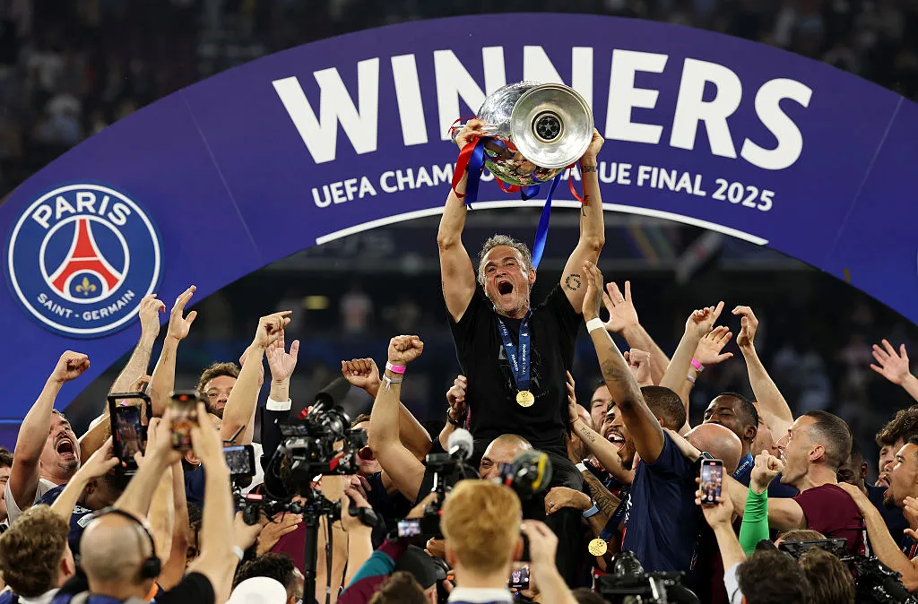 MUNICH, GERMANY – MAY 31: Luis Enrique, Head Coach of Paris Saint-Germain, lifts the UEFA Champions League trophy after his team’s victory, to secure Paris Saint-Germain’s first ever UEFA Champions League title in the club’s history and a record UEFA Champions League Final winning scoreline of 5-0, following the UEFA Champions League Final 2025 between Paris Saint-Germain and FC Internazionale Milano at Munich Football Arena on May 31, 2025 in Munich, Germany. (Photo by Carl Recine/Getty Images)