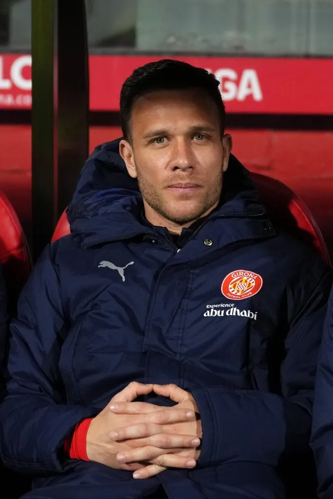 GIRONA, SPAIN – FEBRUARY 14: Arthur Melo of Girona FC looks on from the substitute bench prior to the LaLiga match between Girona FC and Getafe CF at Montilivi Stadium on February 14, 2025 in Girona, Spain. (Photo by Alex Caparros/Getty Images)