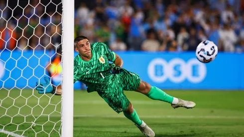 MONTEVIDEO, URUGUAY – NOVEMBER 15: Sergio Rochet of Uruguay fails to save Colombia's first goal scored by a free kick from Juan Fernando Quintero of Colombia (not in frame) during the South American Qualifier match between Uruguay and Colombia at Centenario Stadium on November 15, 2024 in Montevideo, Uruguay. (Photo by Ernesto Ryan/Getty Images)
