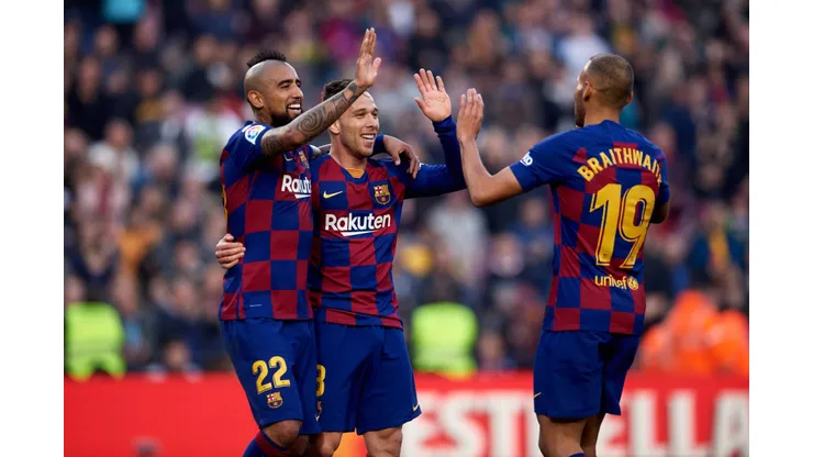 BARCELONA, SPAIN - FEBRUARY 22: Arthur Melo of FC Barcelona celebrates scoring his team's fifth goal with his teammates Arturo Vidal and Martin Braithwaite during the La Liga match between FC Barcelona and SD Eibar SAD at Camp Nou on February 22, 2020 in Barcelona, Spain. (Photo by Alex Caparros/Getty Images)