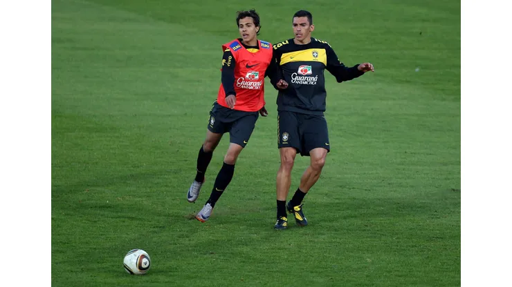 JOHANNESBURG, SOUTH AFRICA - JUNE 03: Nilmar (L) and Lucio battle for the ball during the Brazil Training session at Dobsonville Stadium in Soweto on June 3, 2010 in Johannesburg, South Africa. The Brazil national team are in South Africa to contest the 2010 FIFA World Cup. (Photo by Richard Heathcote/Getty Images)