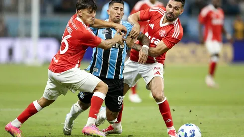 PORTO ALEGRE, BRAZIL – APRIL 19: Cristian Olivera of Gremio and Bruno Henrique and Alexandro Bernabei of Internacional compete for the ball during the match between Gremio and Internacional as part of Brasileirao 2025 at Arena do Gremio on April 19, 2025 in Porto Alegre, Brazil. (Photo by Pedro H. Tesch/Getty Images)