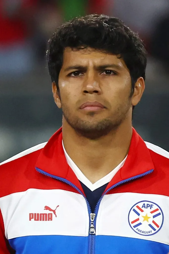 SANTIAGO, CHILE – NOVEMBER 16: Robert Rojas of Paraguay stands for the national anthem prior a FIFA World Cup 2026 Qualifier match between Chile and Paraguay at Estadio Monumental David Arellano on November 16, 2023 in Santiago, Chile. (Photo by Marcelo Hernandez/Getty Images)
