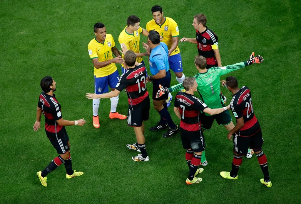BELO HORIZONTE, BRAZIL – JULY 08: Referee Marco Rodriguez restores order after a challenge during the 2014 FIFA World Cup Brazil Semi Final match between Brazil and Germany at Estadio Mineirao on July 8, 2014 in Belo Horizonte, Brazil.  (Photo by Felipe Dana – Pool/Getty Images)