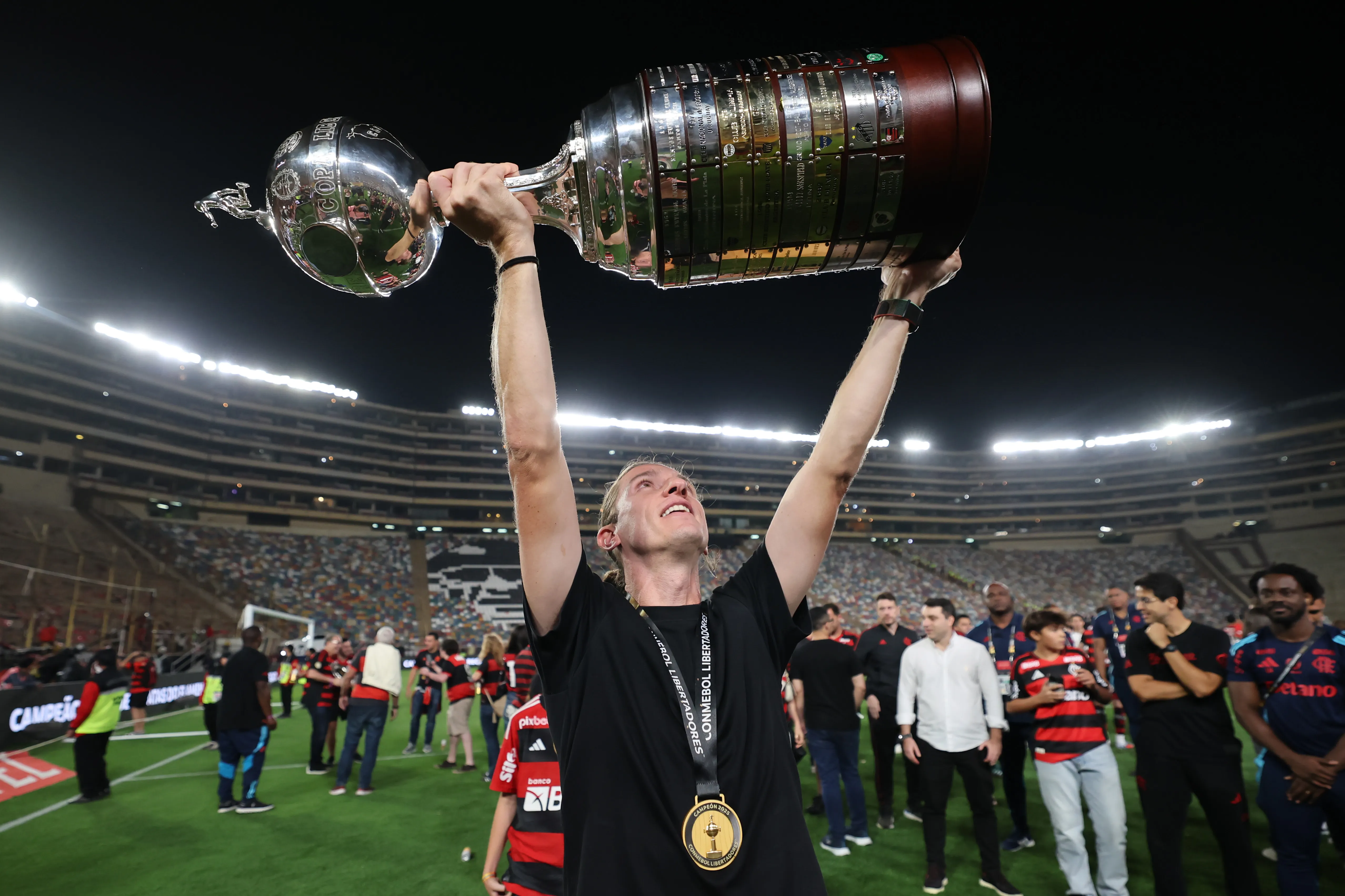 LIMA, PERU – NOVEMBER 29: Filipe Luis, Head Coach of Flamengo, celebrates with the trophy after winning the 2025 Copa CONMEBOL Libertadores Final match between Palmeiras and Flamengo at Estadio Monumental on November 29, 2025 in Lima, Peru.  (Photo by Hector Vivas/Getty Images)