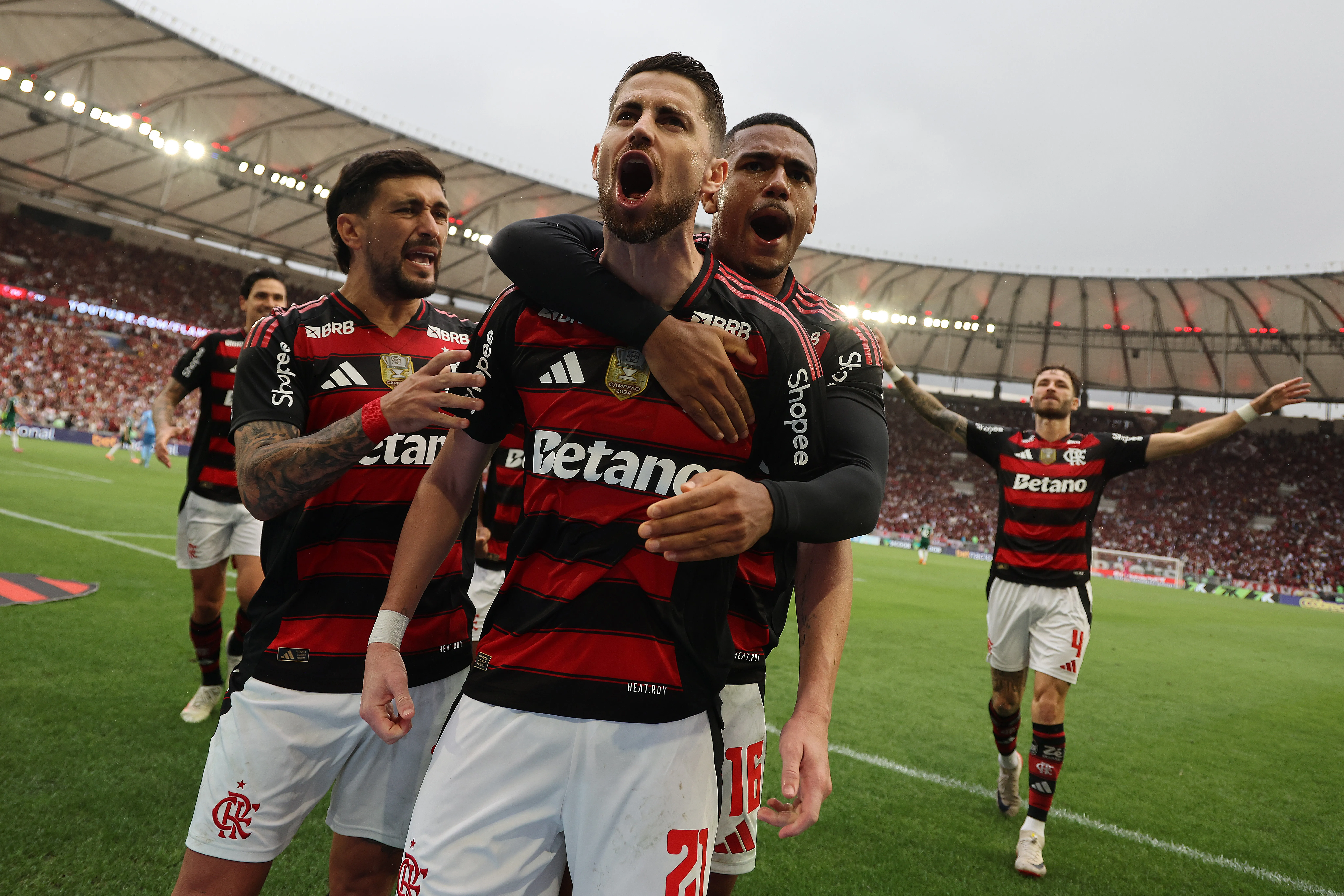 Jorginho of Flamengo celebrates with Giorgian de Arrascaeta, Samuel Lino after scoring the second goal of his team during the match between Flamengo and Palmeiras as part of Brasileirao 2025 at Maracana Stadium on October 19, 2025 in Rio de Janeiro, Brazil. (Photo by Wagner Meier/Getty Images)