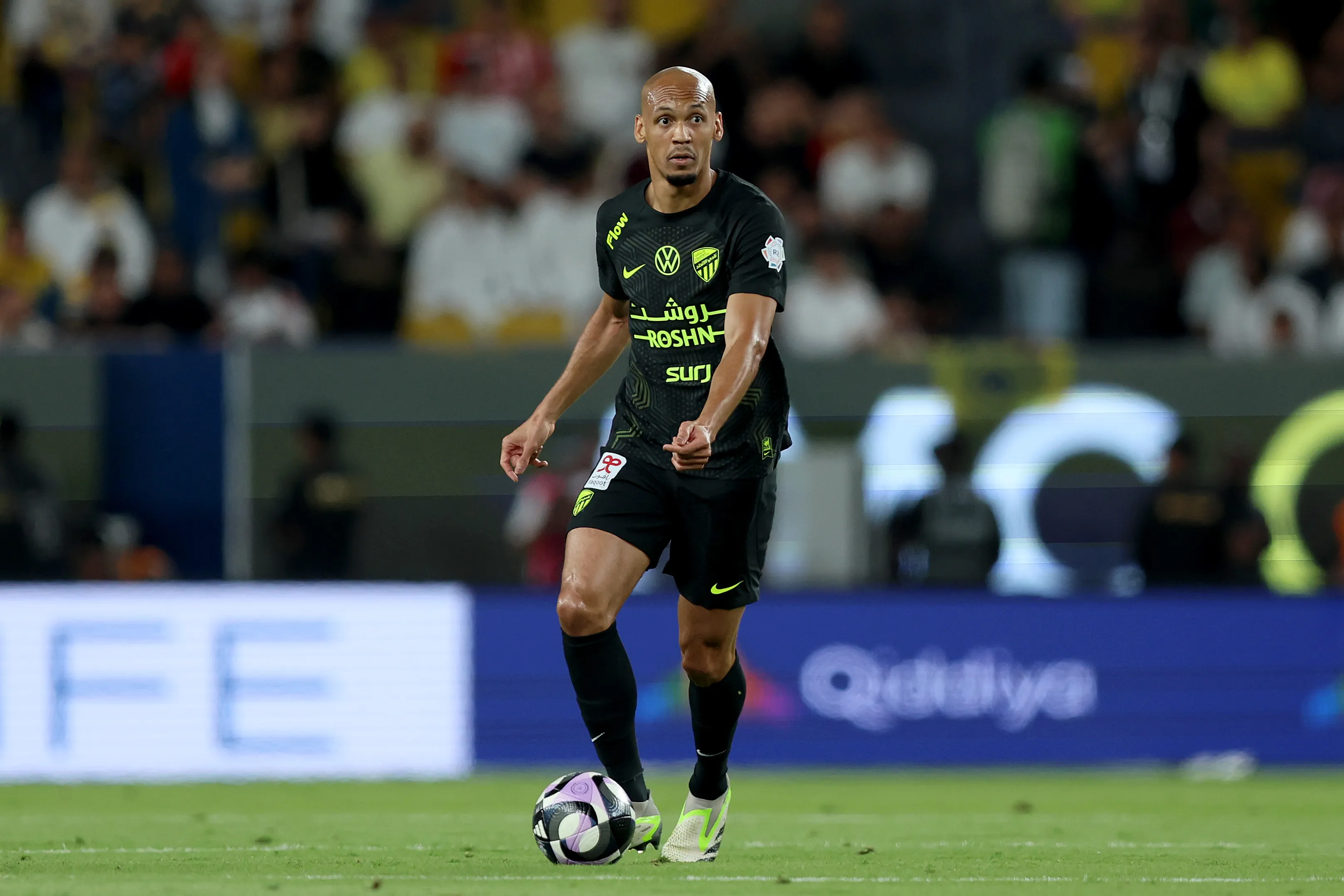 RIYADH, SAUDI ARABIA – MAY 07: Fabinho of Al-Ittihad runs with the ball during the Saudi Pro League match between Al Nassr and Al Ittihad at Al-Awwal Park on May 07, 2025 in Riyadh, Saudi Arabia. (Photo by Yasser Bakhsh/Getty Images)