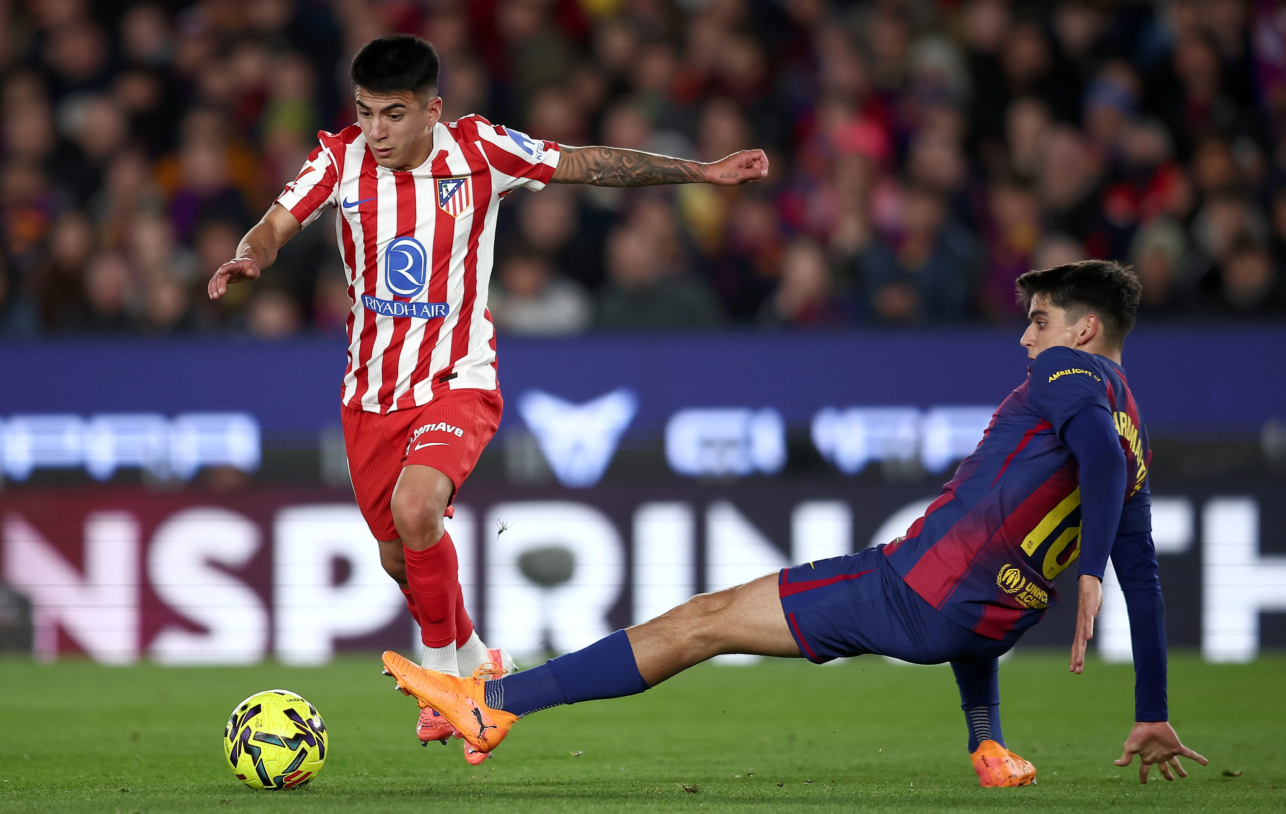 BARCELONA, SPAIN – DECEMBER 02: Thiago Almada of Atletico de Madrid is tackled by Gerard Martin of FC Barcelona during the LaLiga EA Sports match between FC Barcelona and Atletico de Madrid at Spotify Camp Nou on December 02, 2025 in Barcelona, Spain. (Photo by Eric Alonso/Getty Images)