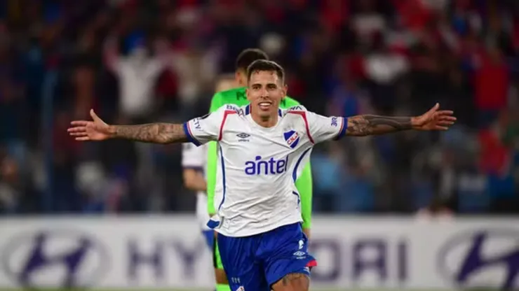 Christian Oliva perto do Santos. Foto: Dante Fernandez/AFP
