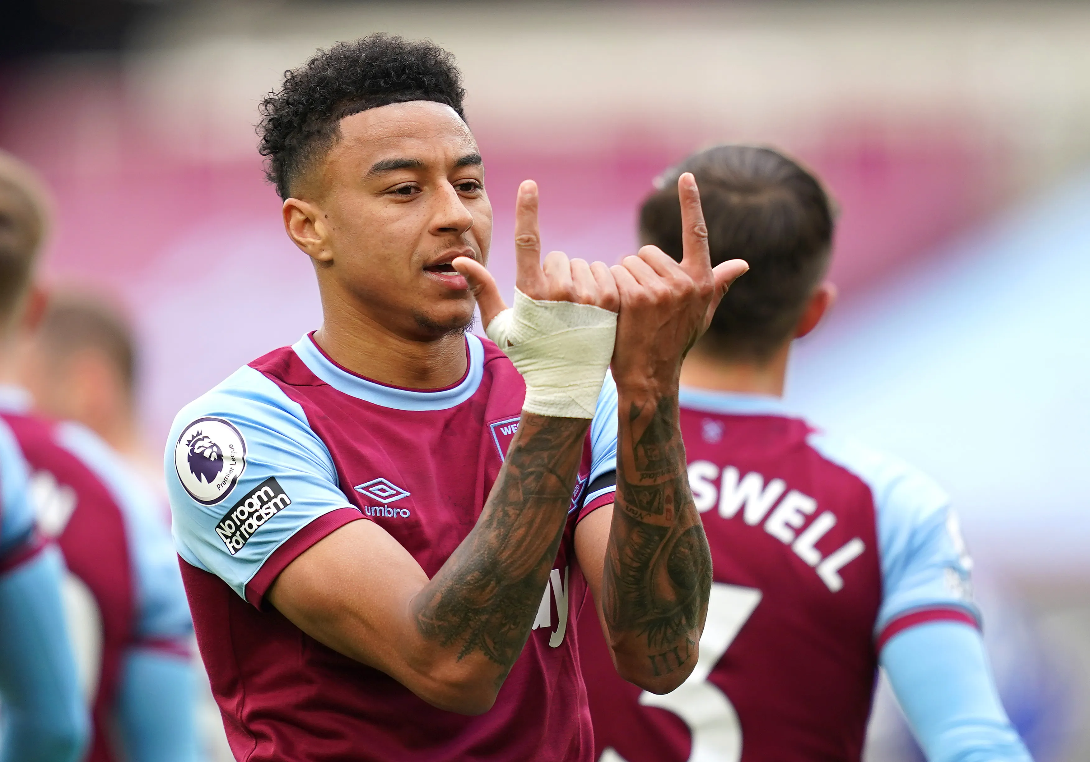 LONDON, ENGLAND – APRIL 11: Jesse Lingard of West Ham United celebrates after scoring their team’s first goal during the Premier League match between West Ham United and Leicester City at London Stadium on April 11, 2021 in London, England. Sporting stadiums around the UK remain under strict restrictions due to the Coronavirus Pandemic as Government social distancing laws prohibit fans inside venues resulting in games being played behind closed doors. (Photo by John Walton – Pool/Getty Images)