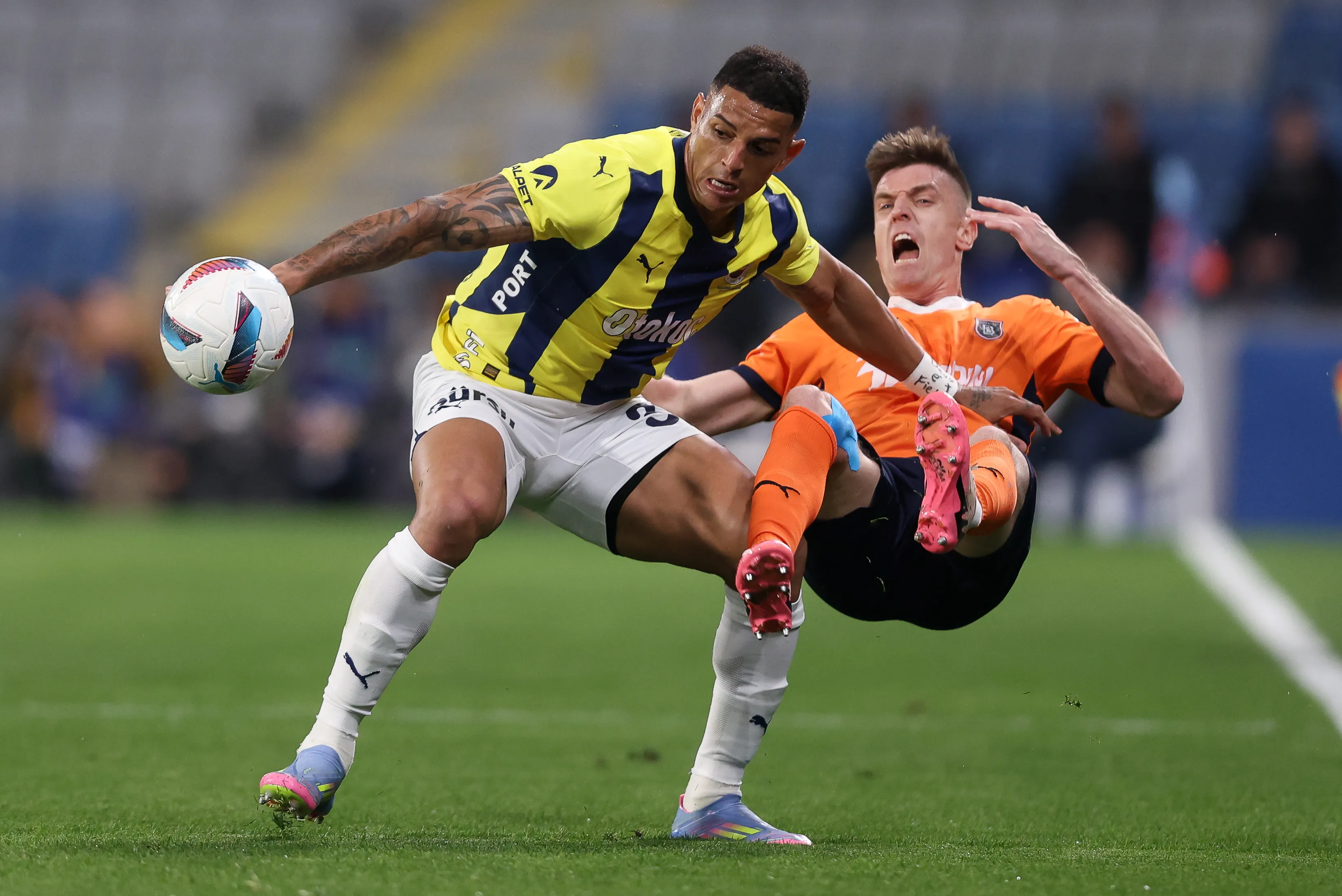 ISTANBUL, TURKEY – MAY 9: Diego Carlos of Fenerbahce battles for the ball with Krzysztof Piatek of Basaksehir reacts during the Turkish Super League match between Istanbul Basaksehir and Fenerbahce at Ulker Stadium on May 9, 2025 in Istanbul, Turkey. (Photo by Ahmad Mora/Getty Images)