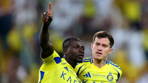 Sadio Mane of Al Nassr celebrates with teammate Otavio after scoring his team's first goal during the Saudi Pro League match between Al Nassr and Al Ittihad at Al-Awwal Park on May 07, 2025 in Riyadh, Saudi Arabia.