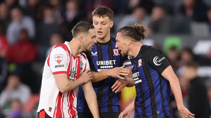 SOUTHAMPTON, ENGLAND - MAY 12: Taylor Harwood-Bellis of Southampton clashes with Luke Ayling of Middlesbrough during the Sky Bet Championship Play Off Semi Final Second Leg match between Southampton and Middlesbrough at St Mary's Stadium on May 12, 2026 in Southampton, England. (Photo by Warren Little/Getty Images)