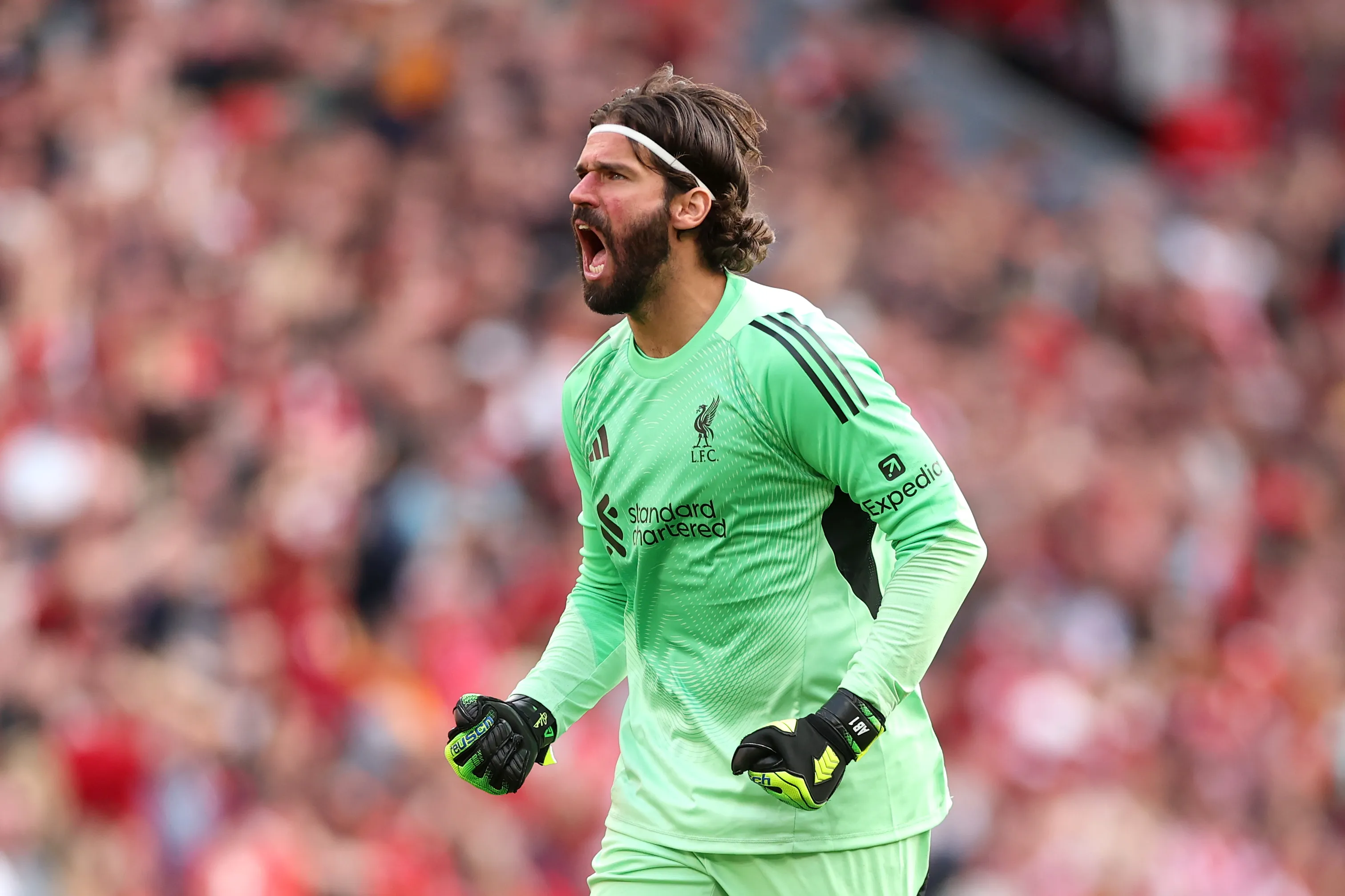 LIVERPOOL, ENGLAND – AUGUST 31: Alisson Becker of Liverpool celebrates after teammate Dominik Szoboszlai (not pictured) scored the team’s first goal from a free kick during the Premier League match between Liverpool and Arsenal at Anfield on August 31, 2025 in Liverpool, England. (Photo by Alex Pantling/Getty Images)
