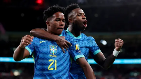 Endrick of Brazil celebrates scoring his team's first goal with teammate Vinicius Junior during the international friendly match between England and Brazil at Wembley Stadium on March 23, 2024 in London, England.