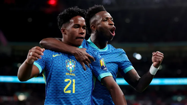 Endrick of Brazil celebrates scoring his team's first goal with teammate Vinicius Junior during the international friendly match between England and Brazil at Wembley Stadium on March 23, 2024 in London, England.