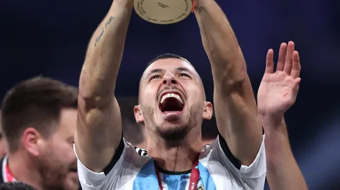 LUSAIL CITY, QATAR - DECEMBER 18: Guido Rodriguez of Argentina lifts the FIFA World Cup Qatar 2022 Winner's Trophy during the FIFA World Cup Qatar 2022 Final match between Argentina and France at Lusail Stadium on December 18, 2022 in Lusail City, Qatar. (Photo by Julian Finney/Getty Images)
