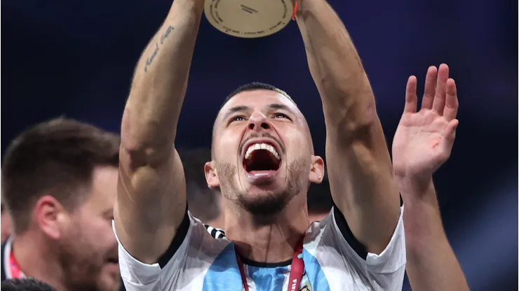 LUSAIL CITY, QATAR - DECEMBER 18: Guido Rodriguez of Argentina lifts the FIFA World Cup Qatar 2022 Winner's Trophy during the FIFA World Cup Qatar 2022 Final match between Argentina and France at Lusail Stadium on December 18, 2022 in Lusail City, Qatar. (Photo by Julian Finney/Getty Images)