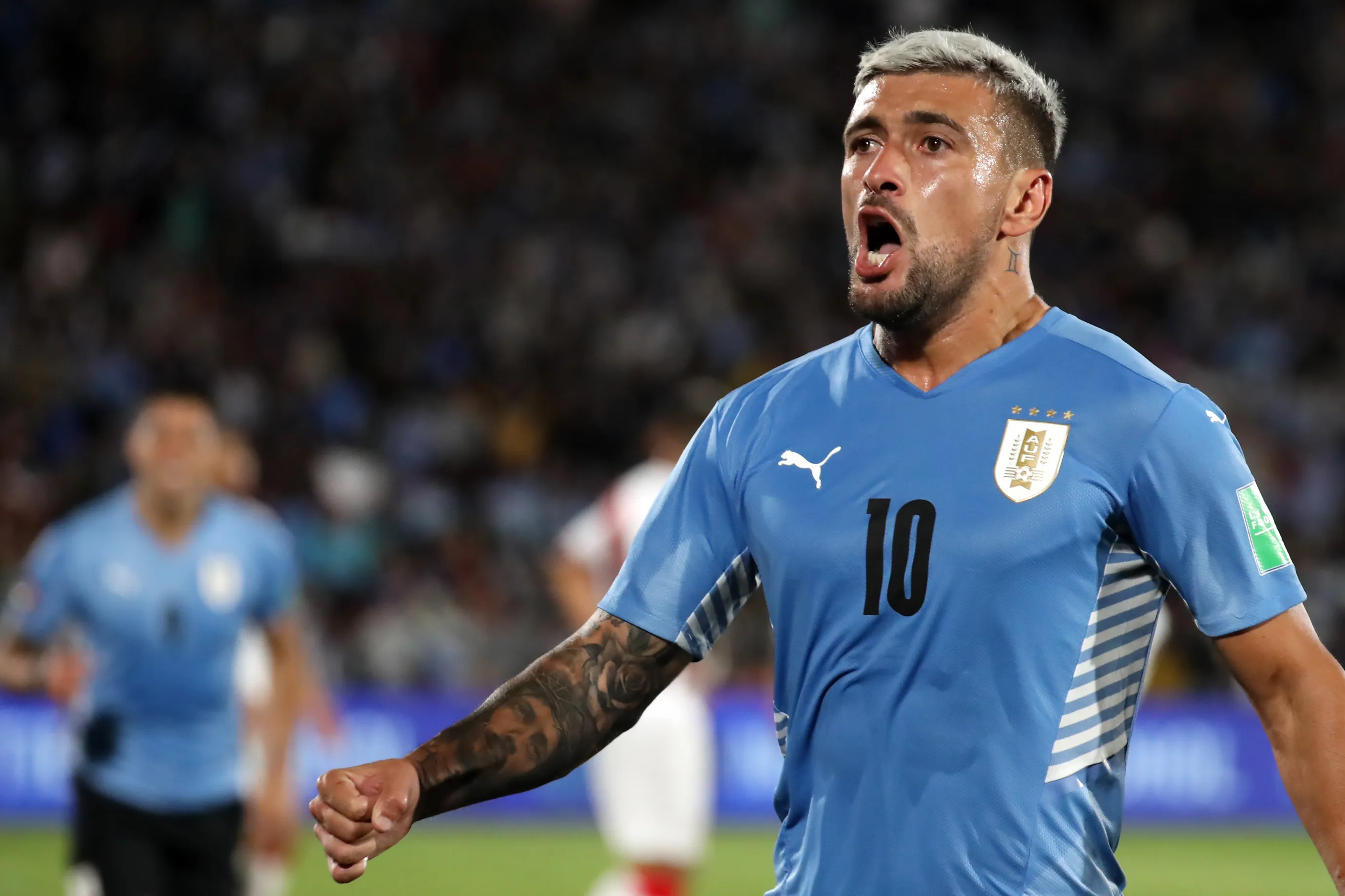 MONTEVIDEO, URUGUAY – MARCH 24: Giorgian De Arrascaeta of Uruguay celebrates after scoring the opening goal during a match between Uruguay and Peru as part of FIFA World Cup Qatar 2022 Qualifiers at Centenario Stadium on March 24, 2022 in Montevideo, Uruguay. (Photo by Raul Martinez – Pool/Getty Images)