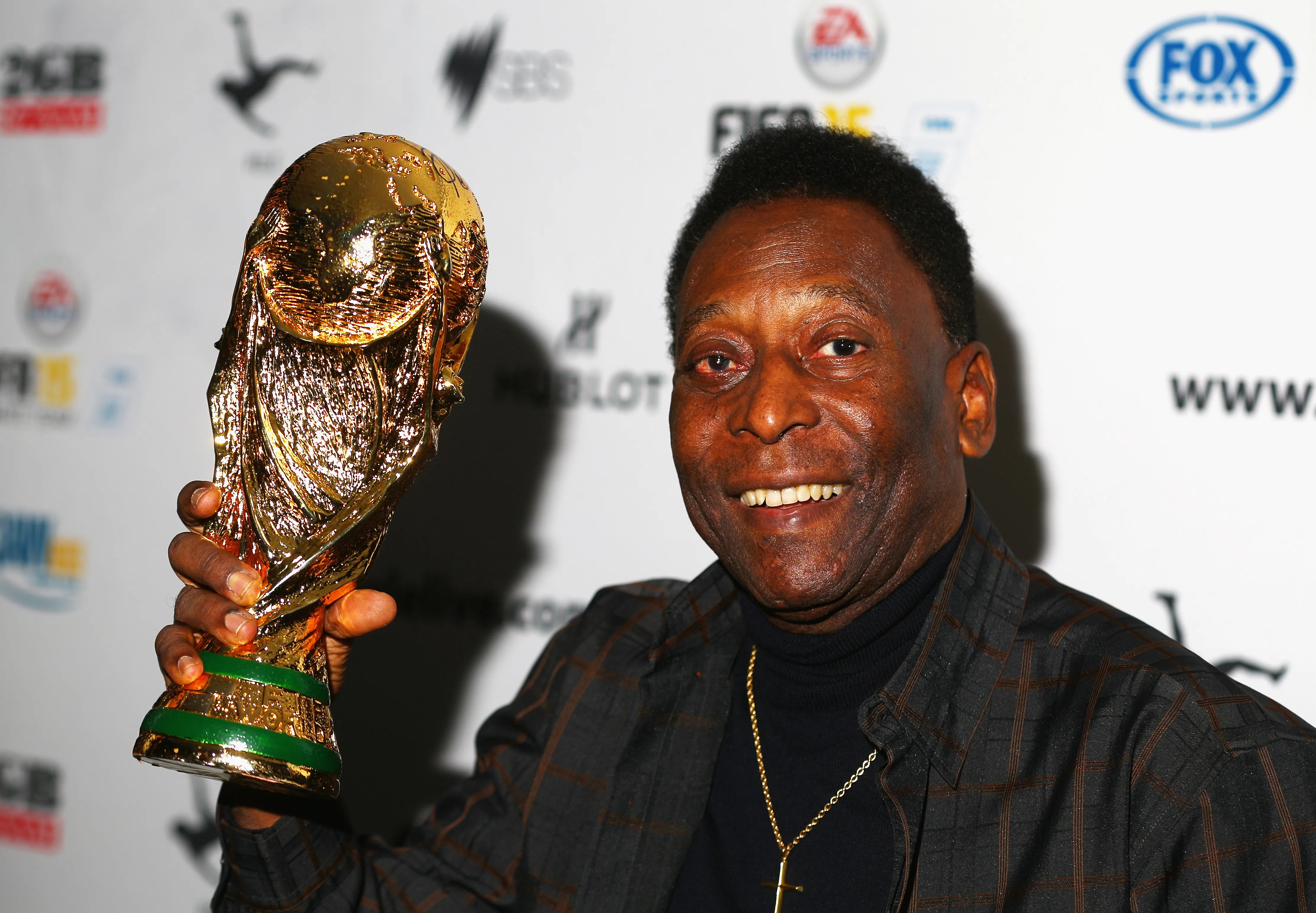 MELBOURNE, AUSTRALIA – MARCH 26: Pele holds a replica Wolrd Cup trophy during a press conference at The Peninsula on March 26, 2015 in Melbourne, Australia.  (Photo by Robert Cianflone/Getty Images)