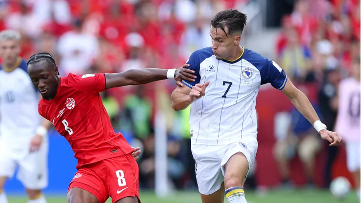 TORONTO, ONTARIO - JUNE 12: Ismael Kone #8 of Canada is challenged by Amar Dedic #7 of Bosnia and Herzegovina during the FIFA World Cup 2026 Group B match between Canada and Bosnia and Herzegovina at Toronto Stadium on June 12, 2026 in Toronto, Ontario. (Photo by Francois Nel/Getty Images)