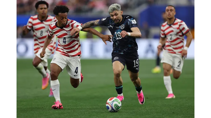 LOS ANGELES, CALIFORNIA - JUNE 12: Haji Wright #19 of the United States runs with the ball under pressure from Tyler Adams #4 of the United States during the FIFA World Cup 2026 Group D match between USA and Paraguay at Los Angeles Stadium on June 12, 2026 in Los Angeles, California. (Photo by Jamie Squire/Getty Images)