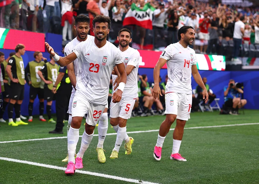 Ramin Rezaeian #23 of IR Iran celebrates with teammates after scoring his team’s first goal during the FIFA World Cup 2026 Group G match between IR Iran and New Zealand at Los Angeles Stadium on June 15, 2026 in Los Angeles, California. (Photo by Dean Mouhtaropoulos/Getty Images)