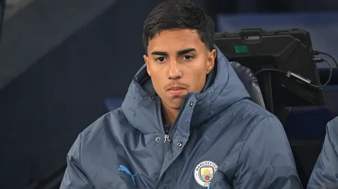 MANCHESTER, ENGLAND – JANUARY 25: Vitor Reis of Manchester City looks on from the substitutes bench prior to the Premier League match between Manchester City FC and Chelsea FC at Etihad Stadium on January 25, 2025 in Manchester, England. (Photo by Michael Regan/Getty Images)