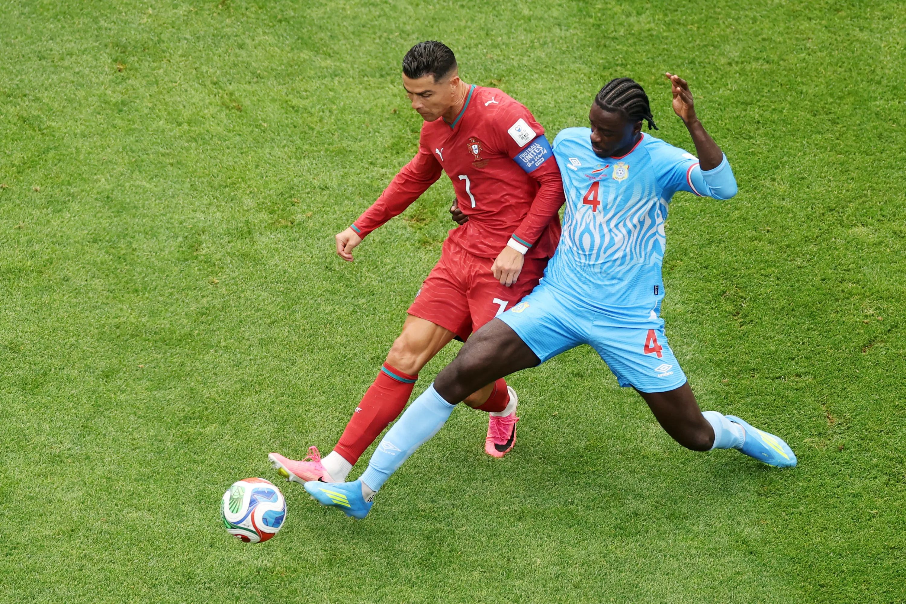 HOUSTON, TEXAS – JUNE 17: Cristiano Ronaldo #7 of Portugal is challenged by Axel Tuanzebe #4 of Congo DR during the FIFA World Cup 2026 Group K match between Portugal and Congo DR at Houston Stadium on June 17, 2026 in Houston, Texas. (Photo by Lars Baron/Getty Images)