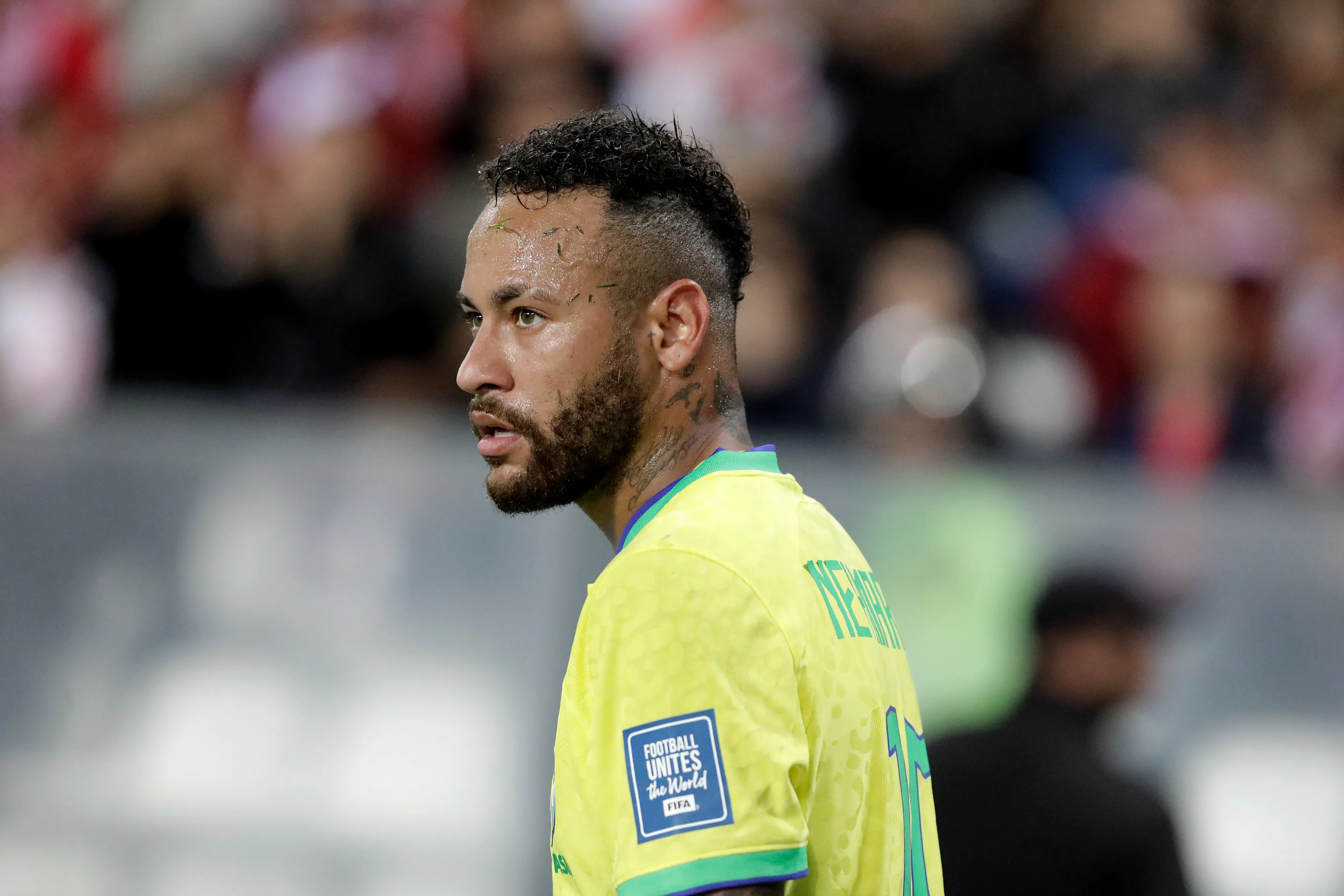 LIMA, PERU – SEPTEMBER 12: Detailed view of the “Football Unites the World” badge from Neymar Jr. of Brazil during a FIFA World Cup 2026 Qualifier match between Peru and Brazil at Estadio Nacional de Lima on September 12, 2023 in Lima, Peru. (Photo by Mariana Bazo/Getty Images)