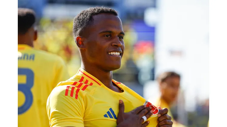 EAST HARTFORD, CT - JUNE 15: Jhon Arias of Colombia touches the logo on his jersey after scoring against Bolivia during the first half of their international friendly match at Pratt & Whitney Stadium on June 15, 2024 in Hartford, Connecticut. (Photo By Winslow Townson/Getty Images)