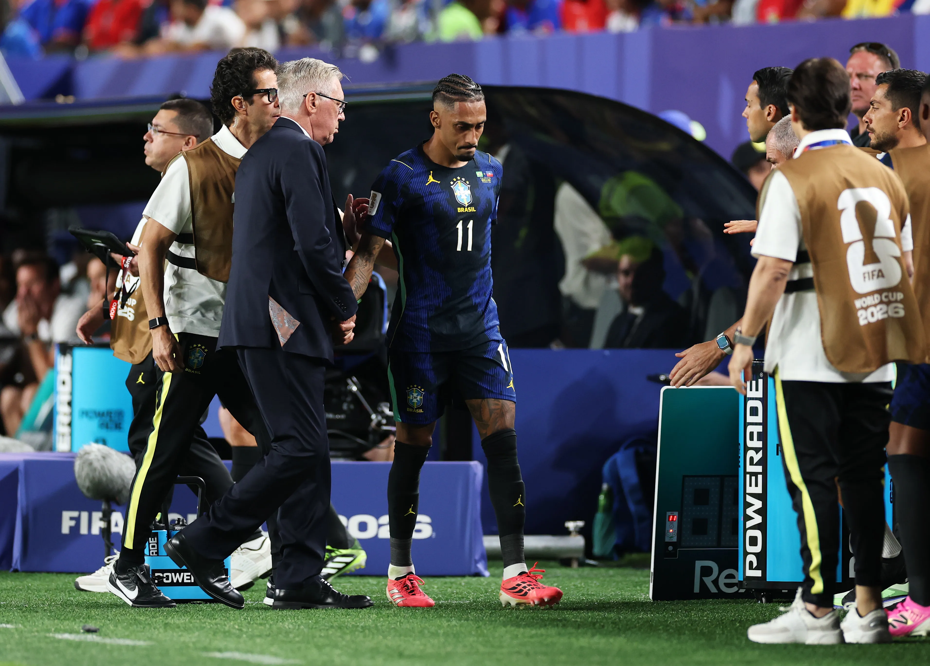PHILADELPHIA, PENNSYLVANIA – JUNE 19: Raphinha #11 of Brazil reacts alongside Carlo Ancelotti, Head Coach of Brazil, as he leaves the pitch with an injury during the FIFA World Cup 2026 Group C match between Brazil and Haiti at Philadelphia Stadium on June 19, 2026 in Philadelphia, Pennsylvania. (Photo by Dan Mullan/Getty Images)