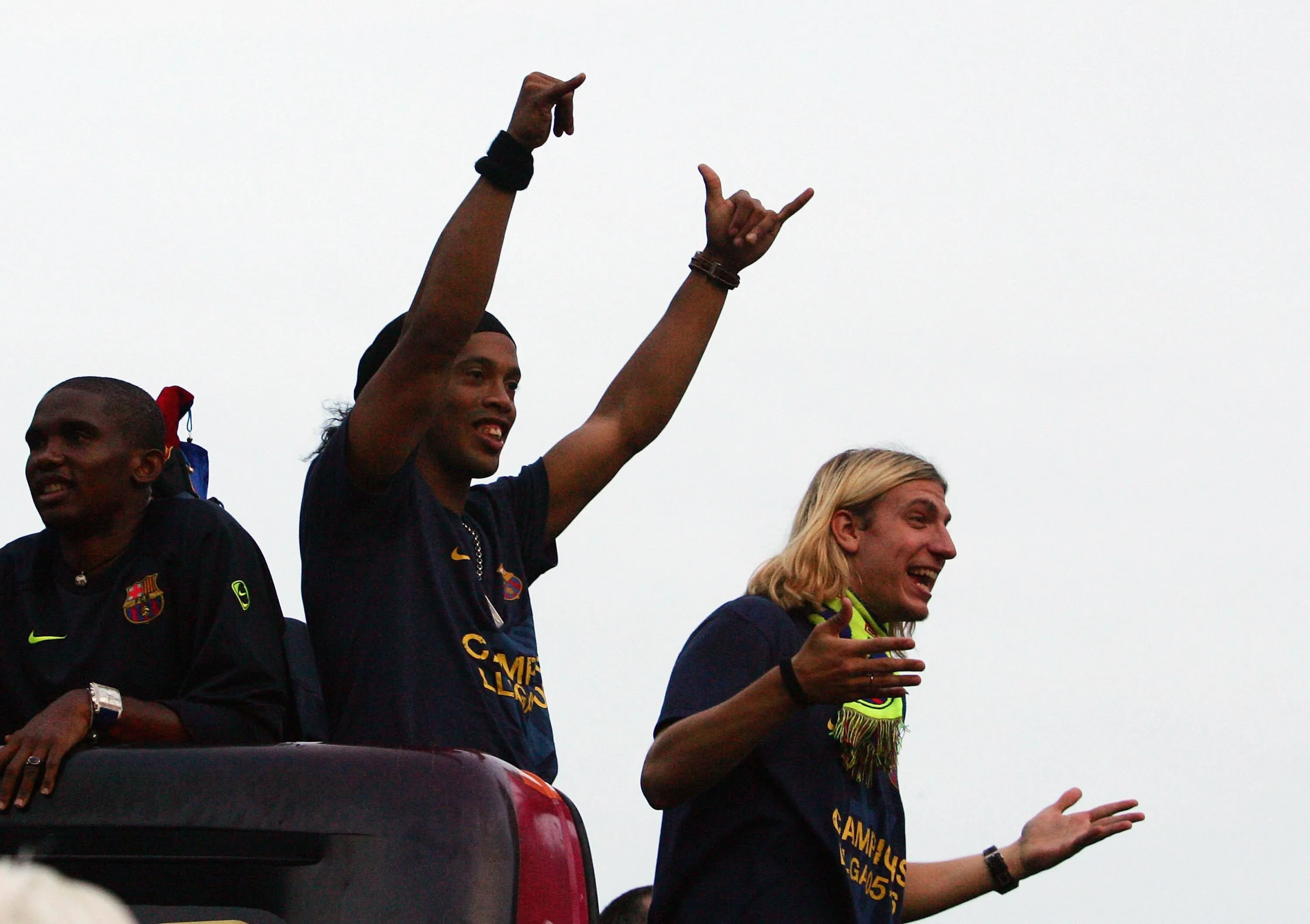 Ronaldinho (Center) of Barcelona waves from on an open-roof bus beside Samuel Eto’o (L) and Maxi Lopez during team celebrations after winning the Primera Liga on May 7, 2006 in Barcelona, Spain.  (Photo by Denis Doyle/Getty Images)