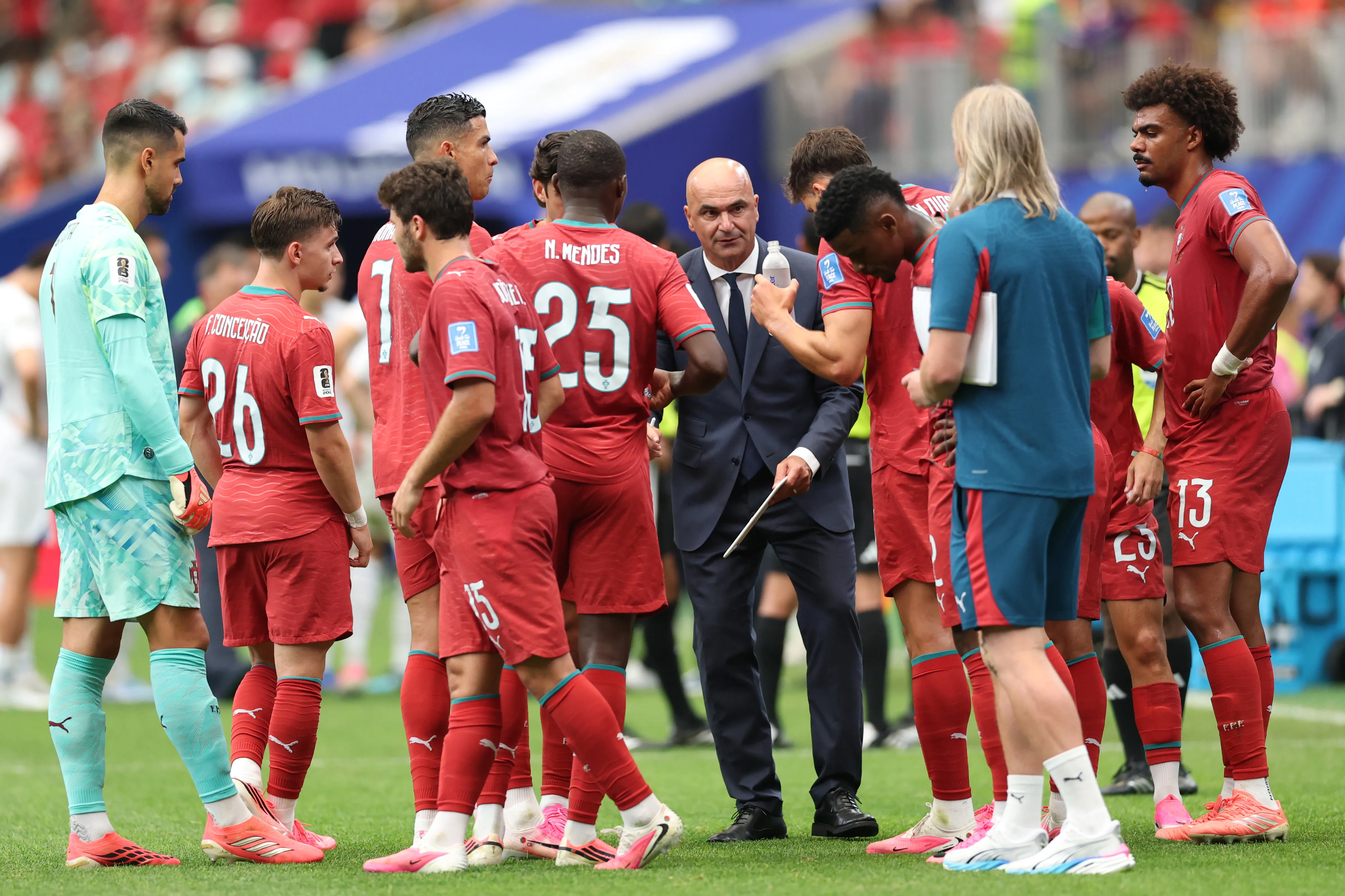 HOUSTON, TEXAS – JUNE 23: Roberto Martinez, Head Coach of Portugal, speaks to players at the hydration break during the FIFA World Cup 2026 Group K match between Portugal and Uzbekistan at Houston Stadium on June 23, 2026 in Houston, Texas. (Photo by Michael Steele/Getty Images)