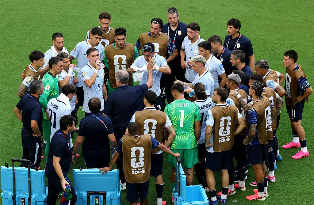 Marcelo Bielsa, Head Coach of Uruguay, speaks with his players during a hydration break in the FIFA World Cup 2026 Group H match between Uruguay and Cabo Verde at Miami Stadium on June 21, 2026 in Miami Gardens, Florida. (Photo by Molly Darlington/Getty Images)
